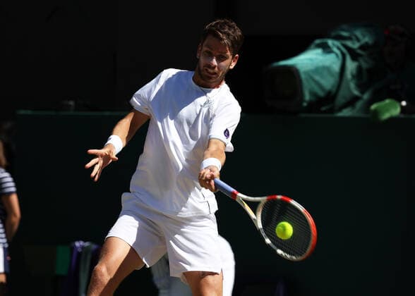 8th July 2022, All England Lawn Tennis and Croquet Club, London, England; Wimbledon Tennis tournament; Cameron Norrie (GBR) plays a forehand to Novak& xa0;Djokovic (SRB) in the mens singles semi-final  ActionPlus12406012 JohnxPatrickxFletcher
