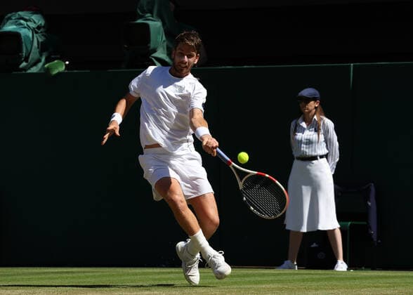 8th July 2022, All England Lawn Tennis and Croquet Club, London, England; Wimbledon Tennis tournament; Cameron Norrie (GBR) plays a forehand to Novak& xa0;Djokovic (SRB) in the mens singles semi-final  ActionPlus12406015 JohnxPatrickxFletcher