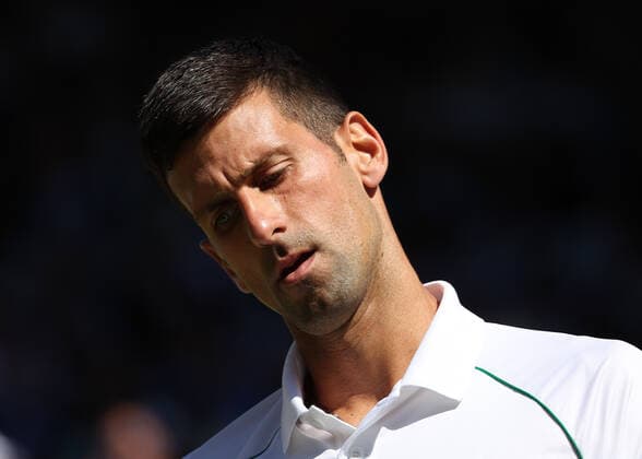 8th July 2022, All England Lawn Tennis and Croquet Club, London, England; Wimbledon Tennis tournament; A disappointed Novak& xa0;Djokovic (SRB) looks o in the mens singles semi-final match  ActionPlus12406022 JohnxPatrickxFletcher