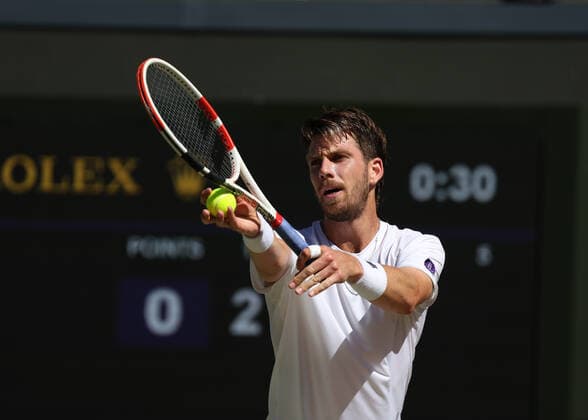 8th July 2022, All England Lawn Tennis and Croquet Club, London, England; Wimbledon Tennis tournament; Cameron Norrie (GBR) serves to Novak& xa0;Djokovic (SRB) in the mens singles semi-final match  ActionPlus12406049 JohnxPatrickxFletcher