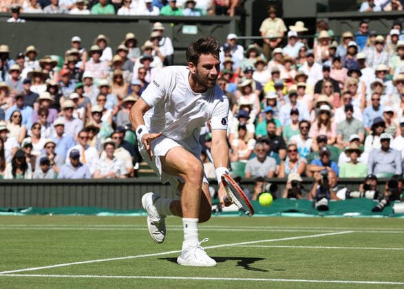 8th July 2022, All England Lawn Tennis and Croquet Club, London, England; Wimbledon Tennis tournament; Cameron Norrie (GBR) plays a backhand to Novak& xa0;Djokovic (SRB) in the mens singles semi-final match  ActionPlus12406041 JohnxPatrickxFletcher