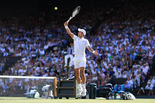 Tennis - Wimbledon (Day 12) 8th July 2022 - Tennis - Wimbledon (Day 12) - Novak Djokovic (SRB) jumps up to play a volley during his Gentlemen s Singles Semi Final match - Photo: Simon Stacpoole Offside. London UK Copyright: xSimonxStacpoolexOffside