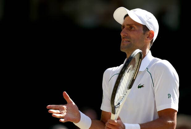 (220709) -- LONDON, July 9, 2022 -- Novak Djokovic of Serbia reacts during the men s singles semifinal match against Cameron Norrie of Great Britain at Wimbledon Tennis Championship in London, Britain, on July 8, 2022. ) (SP)BRITAIN-LONDON-TENNIS-WIMBLEDON-MEN S SINGLES-SEMIFINALS LixYing 