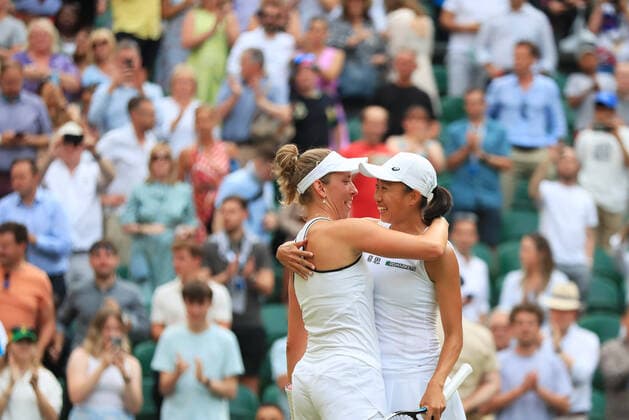 (220709) -- LONDON, July 9, 2022 -- Zhang Shuai (R) of China Elise Mertens of Belgium celebrate after winning the women s doubles semifinal match against Danielle Collins Desirae Krawczyk of the United States at Wimbledon Tennis Championship in London, Britain, on July 8, 2022. ) (SP)BRITAIN-LONDON-TENNIS-WIMBLEDON-WOMEN S DOUBLES-SEMIFINALS LixYing 