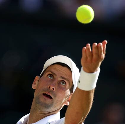 (220709) -- LONDON, July 9, 2022 -- Novak Djokovic of Serbia serves during the men s singles semifinal match against Cameron Norrie of Great Britain at Wimbledon Tennis Championship in London, Britain, on July 8, 2022. ) (SP)BRITAIN-LONDON-TENNIS-WIMBLEDON-MEN S SINGLES-SEMIFINALS LixYing 