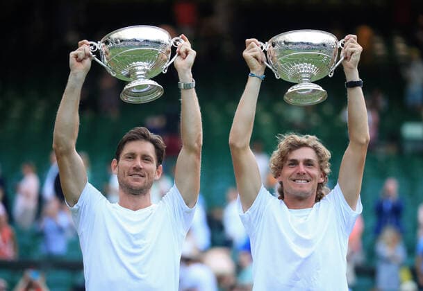 (220710) -- LONDON, July 10, 2022 -- Australia s Matthew Ebden Max Purcell (R) pose with their trophies during the awarding ceremony for the men s doubles event at Wimbledon Tennis Championship in London, Britain, July 9, 2022. ) (SP)BRITAIN-LONDON-TENNIS-WIMBLEDON-MEN S DOUBLES-FINAL LixYing 