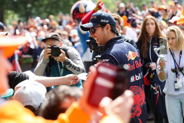 FORMULA 1 - GP of Austria 2022 SPIELBERG,AUSTRIA,10.JUL.22 - MOTORSPORTS, FORMULA 1 - Grand Prix of Austria, Red Bull Ring. Image shows Sergio Perez (MEX Red Bull Racing) signing autographs.  GEPAxpictures xChristianxWalgram