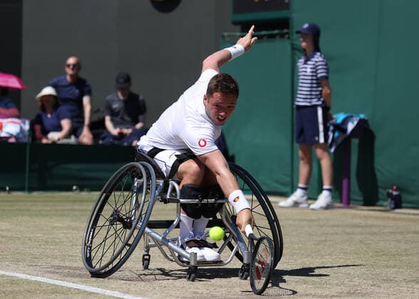 10th July 2022, All England Lawn Tennis and Croquet Club, London, England; Wimbledon Tennis tournament; Alfie Hewett (GBR) plays a backhand to Shingo Kunieda (JPN) during the mens wheelchair final  ActionPlus12407117 JohnxPatrickxFletcher