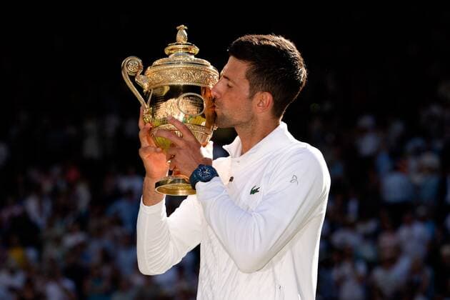 Mandatory Credit: Photo by Ella Ling Shutterstock (13018059es) Novak Djokovic kisses the trophy after winning the Men s Singles FInal Wimbledon Tennis Championships, Day 14, The All England Lawn Tennis and Croquet Club, London, UK - 10 Jul 2022 Wimbledon Tennis Championships, Day 14, The All England Lawn Tennis and Croquet Club, London, UK - 10 Jul 2022  Copyright: xEllaxLing Shutterstockx 13018059es