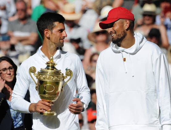 Tennis Championships - Week Two - Day Fourteen - All England Lawn Tennis Club, Wimbledon - Sunday 10th July 2022 Mens Singles Final. Novak Djokovic v Nick Kyrgios Novak Djokovic with the trophy shares a joke with runner up, Nick Kyrgios 