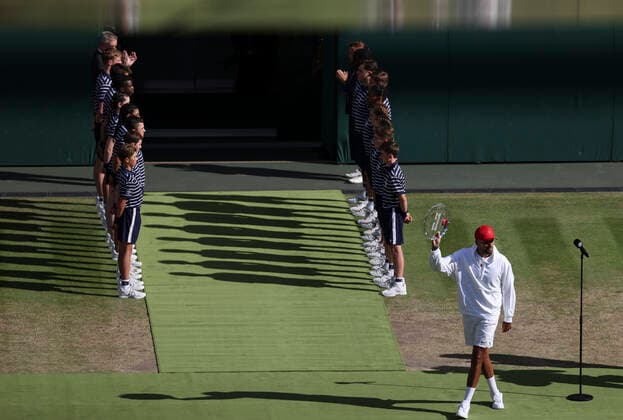 (220711) -- LONDON, July 11, 2022 -- Nick Kyrgios walks with his trophy during the awarding ceremony after the men s singles final match between Novak Djokovic of Serbia and Nick Kyrgios of Australia at Wimbledon Tennis Championship in London, Britain, on July 10, 2022. ) (SP)BRITAIN-LONDON-TENNIS-WIMBLEDON-MEN S SINGLES-FINAL HanxYan 