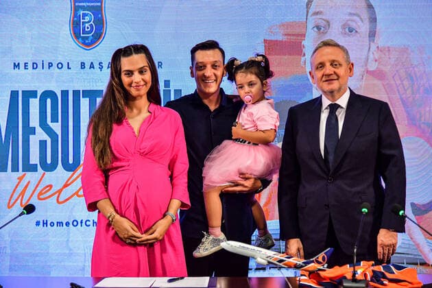 Mesut Özil signed a 1+1 contract with Basaksehir FK, after he got released by Fenerbahce in Istanbul , on July 14 , 2022. Pictured: Mesut Ozil and his wife Amine Gulse , their daughter Eda Ozil and President Goksel Gumusdag. 