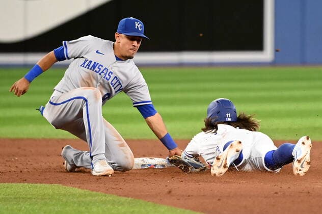 July 14, 2022, Toronto, ON, Canada: Toronto Blue Jays shortstop Bo Bichette, right, slides safely into second base with a steal ahead of a tag by Kansas City Royals second baseman Nicky Lopez in eighth inning American League baseball action in Toronto, Thursday, July 14, 2022. Bo Bichette, Nicky Lopez - ZUMAc35_ 20220714_zaf_c35_096 Copyright: xJonxBlackerx