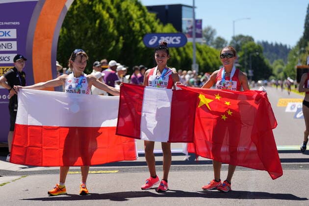 (220716) -- EUGENE, July 16, 2022 -- Gold medalist Kimberly Garcia Leon (C) of Peru celebrates with silver medalist Katarzyna Zdzieblo (L) of Poland and bronze medalist Qieyang Shijie of China after the women s 20km Race Walk final at the World Athletics Championships Oregon22 in Eugene, Oregon, the United States, July 15, 2022. ) (SP)U.S.-EUGENE-ATHLETICS-WORLD CHAMPIONSHIPS-WOMEN S 20KM RACE WALK WangxYing 