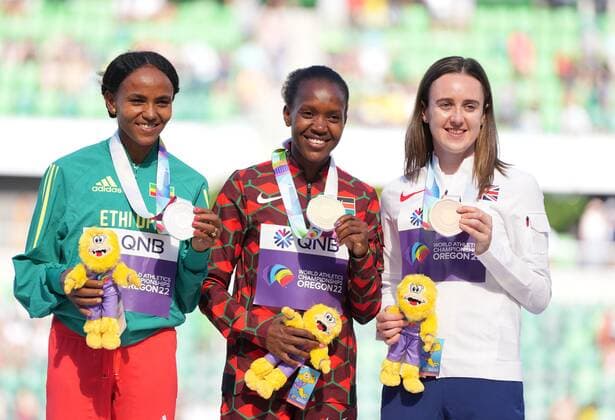 (220720) -- EUGENE, July 20, 2022 -- Gold medalist Kenya s Faith Kipyegon (C) celebrates with silver medalist Gudaf Tsegay (L) of Ethiopia and bronze medalist Britain s Laura Muir during the awarding ceremony for women s 1500m at the World Athletics Championships Oregon22 in Eugene, Oregon, the United States, July 19, 2022. ) (SP)U.S.-EUGENE-ATHLETICS-WORLD CHAMPIONSHIPS-WOMEN S 1500M AWARDING CEREMONY WuxXiaoling 