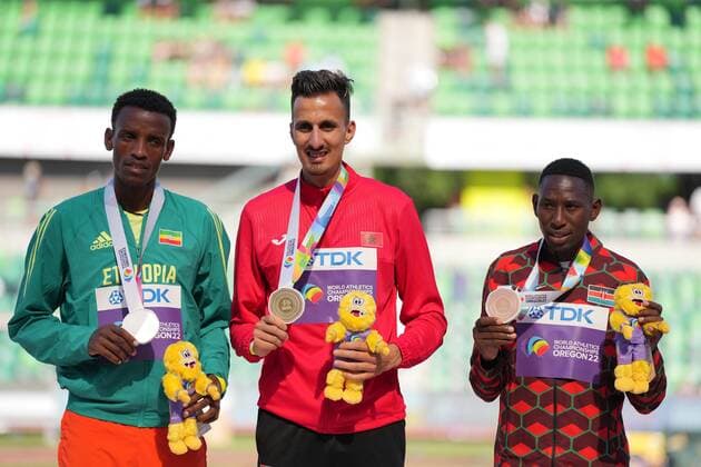 (220720) -- EUGENE, July 20, 2022 -- Gold medalist Soufiane El Bakkali (C) of Morroco poses with silver medalist Lamecha Girma (L) of Ethiopia and bronze medalist Conseslus Kipruto of Kenya during the awarding ceremony for men s 3000m steeplechase at the World Athletics Championships Oregon22 in Eugene, Oregon, the United States, July 19, 2022. ) (SP)U.S.-EUGENE-ATHLETICS-WORLD CHAMPIONSHIPS-MEN S 3000M STEEPLECHASE-AWARDING CEREMONY WuxXiaoling 