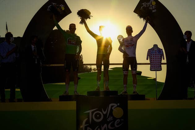 Belgian Wout Van Aert of Team Jumbo-Visma, Danish Jonas Vingegaard of Jumbo-Visma and Slovenian Tadej Pogacar of UAE Team Emirates celebrate on the podium after winning stage 21, the final stage of the Tour de France cycling race, from Paris la Defense Arena to Paris Champs-Elysees, France, on Sunday 24 July 2022. This year s Tour de France takes place from 01 to 24 July 2022. - UK OUT DAVIDxPINTENS  x37790332x