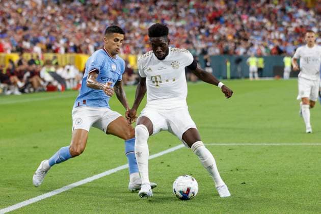 GREEN BAY, WI - JULY 23: Bayern Munich defender Alphonso Davies (19) battles for the ball against Manchester City forward Joao Cancelo (7) during a Club Friendly match on July 23, 2022 at Lambeau Field in Green Bay, Wisconsin. (Photo by Joe Robbins Icon Sportswire) SOCCER: JUL 23 Manchester City v Bayern Munich Icon573220723042