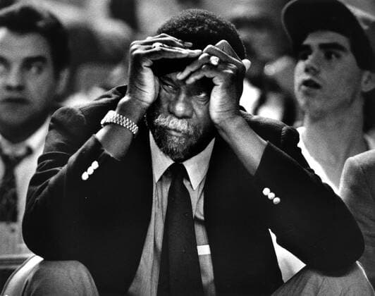 January 19, 1988, Sacramento, California, USA: Sacramento Kings Coach BILL RUSSELL wears a long face, hands to his face, as his ailing team once again fell behind the Houston Rockets at half time. The Kings were able to turn the tide in the closing moments of the game, winning 107-104. Sacramento USA - ZUMAs76_ 20010413_mda_s76_001 Copyright: xMitchxTollx