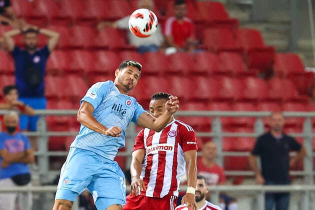 Olympiacos F.C. v Slovan Bratislava UEFA Europa League Pierre Kunde of Olympiacos F.C. and Eric Ramírez of Slovan Bratislava jump for the ball during the UEFA Europa League Third Qualifying Round First Leg match at Karaiskakis Stadium, Piraeus Content Not Available For UK Newspapers Copyright: xYannisxHalasx FIL-17174-0062 UK Newspapers OUT