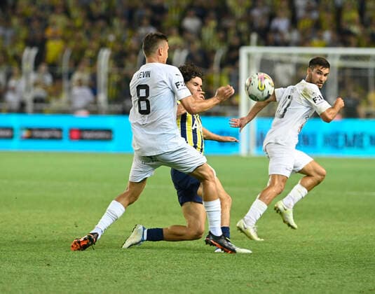 Ferdi Kadioglu of Fenerbahce SK and Vladislav Levin (8) of FC Slovacko during the UEFA Europa League Third Qualifying Round first Leg match between Fenerbahce SK and FC Slovacko at Ulker Stadium in Istanbul Turkey on August 04 , 2022. ( Photo by Seskimphoto ) 