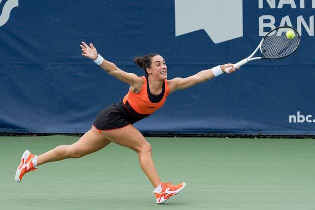 TORONTO, ON - AUGUST 08: Martina Trevisan returns the ball during her National Bank Open tennis tournament first round match on August 8, 2022, at Sobeys Stadium in Toronto, ON, Canada. (Photo by Julian Avram Icon Sportswire via Getty Images) TENNIS: AUG 08 National Bank Open Icon2208080413