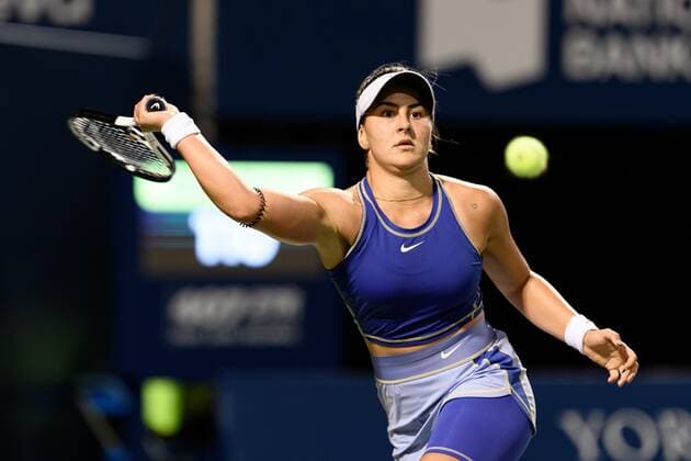 TORONTO, ON - AUGUST 09: Bianca Andreescu returns the ball during her National Bank Open tennis tournament first round match on August 9, 2022, at Sobeys Stadium in Toronto, ON, Canada. (Photo by Julian Avram Icon Sportswire) TENNIS: AUG 09 National Bank Open Icon2208093526