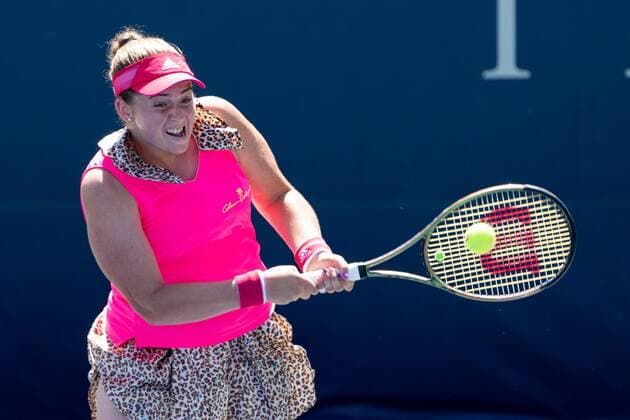 TORONTO, ON - AUGUST 10: Jelena Ostapenko returns the ball during her National Bank Open tennis tournament second round match on August 10, 2022, at Sobeys Stadium in Toronto, ON, Canada. (Photo by Julian Avram Icon Sportswire) TENNIS: AUG 10 National Bank Open Icon2208100845