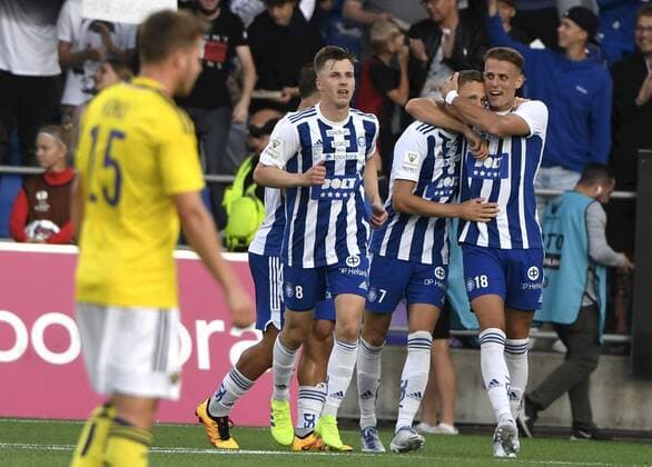 HJK players from left, Lucas Lingman, Santeri Hostikka and Bojan Radulovic celebrating 1-0 goal by Hostikka during the UEFA European League 3rd Qualification Round football match HJK vs Maribor in Helsinki on August 11, 2022. Jan Repas of Maribor walks on the left. Helsinki Finland LKLAPJ20220811201054Q279  Copyright: xJussixNukarix LKLAPJ20220811201054Q279