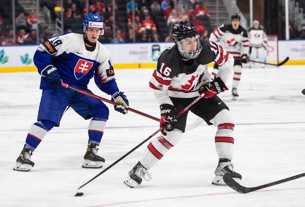 August 11, 2022, EDMONTON, AB, CANADA: Canada s Connor Bedard (16) is chased by Slovakia s Servac Petrovsky (18) during second period IIHF World Junior Hockey Championship action in Edmonton on Thursday August 11, 2022. Canada News - August 11, 2022  - ZUMAc35_ 20220811_zaf_c35_231 Copyright: xJasonxFransonx