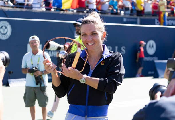 August 14, 2022, Toronto, Ontario, Canada: SIMONA HALEP from Romania holds up her trophy after she defeated Beatriz Haddad Maia 3-6, 6-2, 3-6 to win the National Bank Open in Toronto Canada. Toronto Canada - ZUMAm215 20220814_zip_m215_008 Copyright: xArlynxMcAdoreyx