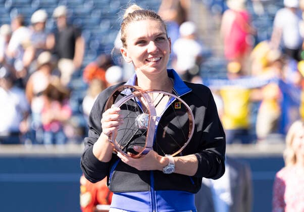 August 14, 2022, Toronto, Ontario, Canada: SIMONA HALEP from Romania holds up her trophy after she defeated Beatriz Haddad Maia 3-6, 6-2, 3-6 to win the National Bank Open in Toronto Canada. Toronto Canada - ZUMAm215 20220814_zip_m215_010 Copyright: xArlynxMcAdoreyx