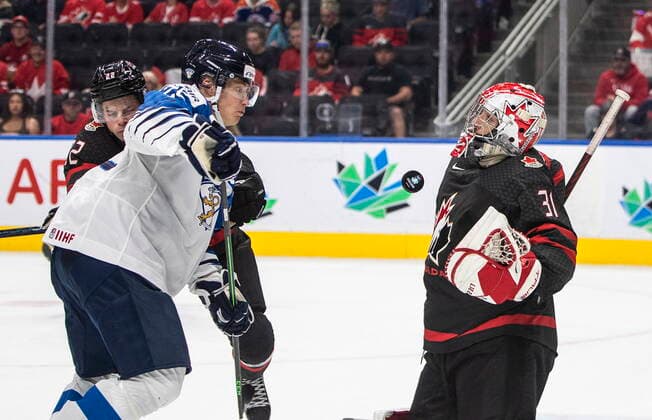 August 15, 2022, EDMONTON, AB, CANADA: Canada goalie Dylan Garand (31) makes the save on Finland s Roni Hirvonen (22) as Jack Thompson (22) defends during third period IIHF World Junior Hockey Championship action in Edmonton on Monday August 15, 2022. Canada News - August 15, 2022  - ZUMAc35_ 20220815_zaf_c35_090 Copyright: xJasonxFransonx