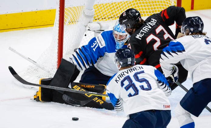 August 20, 2022, Edmonton, AB, CANADA: Finland goalie Juha Jatkola, left, blocks a shot from Canada forward Mason McTavish during first period IIHF World Junior Hockey Championship gold medal game action in Edmonton on Saturday August 20, 2022. Juha Jatkola, Mason McTavish  - ZUMAc35_ 20220820_zaf_c35_052 Copyright: xJeffxMcintoshx