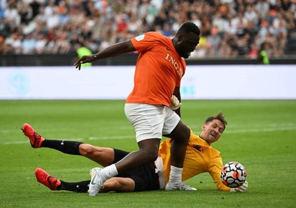 24.08.2022, xjhx, Fussball Benefiz, Team Nowitzki - Team Schumacher emspor, v.l. Gerald Asamoah (Nowitzki All Stars), Rene Adler (Team Schumacher) (DFL DFB REGULATIONS PROHIBIT ANY USE OF PHOTOGRAPHS as IMAGE SEQUENCES and or QUASI-VIDEO) Frankfurt am Main