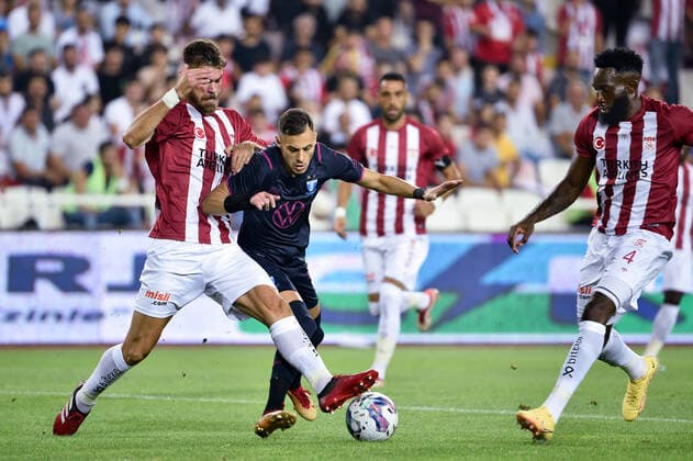 220825 Dimitris Goutas and Aaron Appindangoye of Sivasspor against Veljko Birmancevic of Malmö FF during the UEFA Europa League play-off match between Sivasspor and Malmö FF on August 25, 2022 in Sivas. Photo: Christian Örnberg BILDBYRAN COP 166 CO0221 fotboll football soccer fotball uefa europa league play-off sivasspor malmö ff bbeng Copyright: CHRISTIANxÖRNBERG BB220825CO026