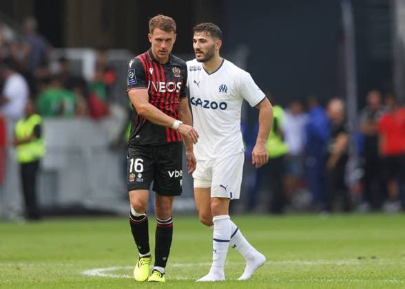 Nice, France, 28th August 2022. Aaron Ramsey of OGC Nice discusses with former Arsenal team mate Read Kolasinac of Olympique De Marseille following the final whistle of the Uber Eats Ligue 1 match at Allianz Riviera Stadium, Nice. Picture credit should read: Jonathan Moscrop Sportimage EDITORIAL USE ONLY. No use with unauthorised audio, video, data, fixture lists, club league logos or live services. Online in-match use limited to 120 images, no video emulation. No use in betting, games or single club league player publications. SPI-1813-0031