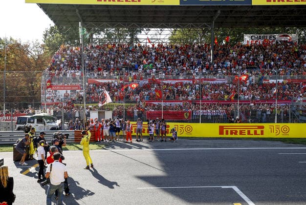 LECLERC Charles (mco), Scuderia Ferrari F1-75, portrait celebrating pole position with the tifosi in the grandstandsduring the Formula 1 Pirelli Gran Premio d™Italia 2022, Italian Grand Prix 2022, 16th round of the 2022 FIA Formula One World Championship, WM, Weltmeisterschaft from September 9 to 11, 2022 on the Autodromo Nazionale di Monza, in Monza, Italy - F1 - ITALIAN GRAND PRIX 2022 DPPI Panoramic  F12022GP16ITA_JK121199