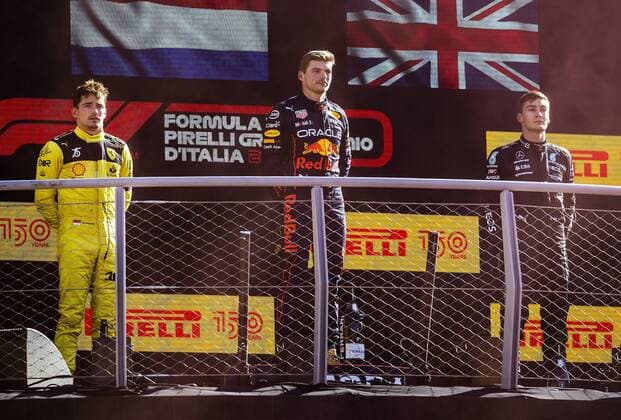 MONZA - (VLNR) Charles Leclerc (Ferrari), Max Verstappen (Oracle Red Bull Racing) and George Russell (Mercedes) on the podium after the F1 Grand Prix of Italy at the Monza Circuit in Monza, Italy. REMKO DE WAAL F1 Grand Prix of Italy - Race 2022 xVIxANPxSportx xxANPxIVx