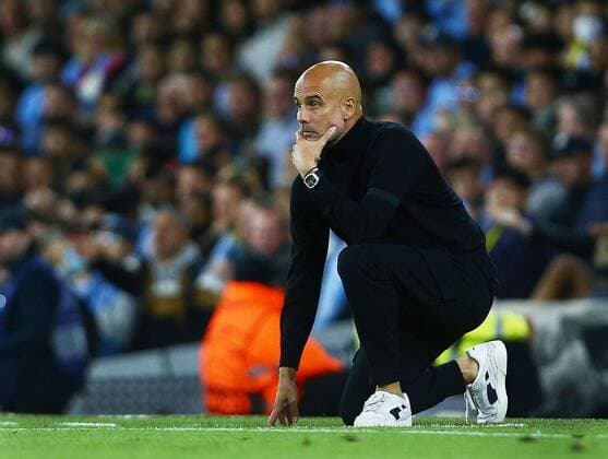 Mandatory Credit: Photo by Matt West Shutterstock (13388092t) Manchester City manager Pep Guardiola on one knee Manchester City v Borussia Dortmund, UEFA Champions League, Group G, Football, Etihad Stadium, Manchester, UK - 14 Sep 2022 Manchester City v Borussia Dortmund, UEFA Champions League, Group G, Football, Etihad Stadium, Manchester, UK - 14 Sep 2022 Copyright: xMattxWest Shutterstockx 13388092t