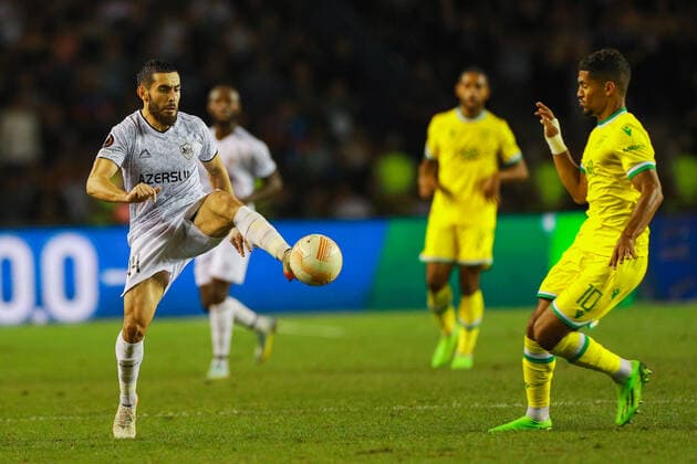 Elvin Jafarguliyev 44 of Qarabag and Ludovic Blas 10 of Nantes during the UEFA Europa League group G match between Qarabag FK and FC Nantes at Tofig Bahramov Stadium on September 15, 2022 in Baku, Azerbaijan. Copyright: xAzizxKarimovx qarabag-nants3