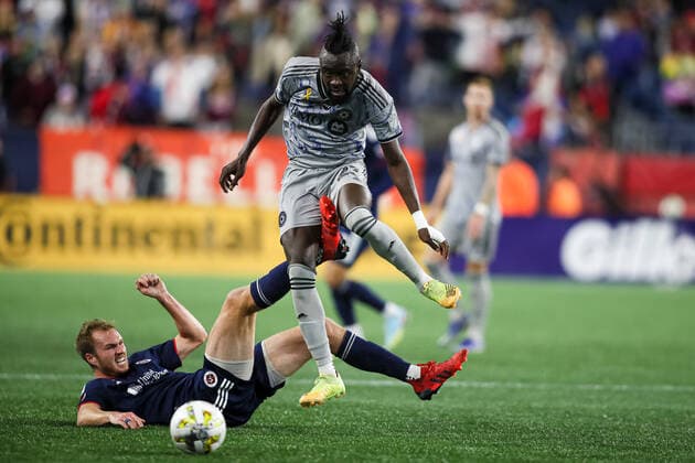 Sep 17, 2022; Foxborough, Massachusetts, USA; CF Montreal forward Kei Kamara (23) vaults over New England Revolution defender Henry Kessler (4) in a game at Gillette Stadium. Cal Media USA - ZUMAc04_ 20220917_zaf_c04_594 Copyright: xBurtxGranofskyx