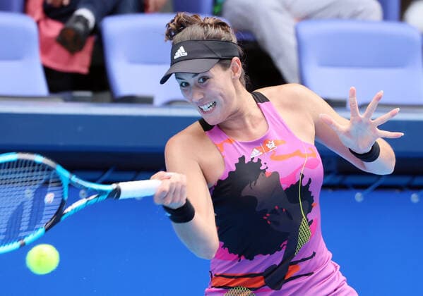 September 21, 2022, Tokyo, Japan - Former world s top ranker Gabrine Muguruza of Spain returns the ball against Despina Papamichail of Greece at the singles second round match at the Toray Pan Pacific Open tennis tournament at the Ariake Coliseum in Tokyo on Wednesday, September 21, 2022. Third seeded Muguruza defeated Papamichail 6-4, 6-2. Noxthirdxpartyxsales  (199128245)