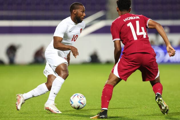 SOCCER - QAT vs CAN, test match VIENNA,AUSTRIA,23.SEP.22 - SOCCER - International test match, Qatar vs Canada. Image shows David Junior Hoilett (CAN) and Homam Elamin Ahmed (QAT).  GEPAxpictures xArminxRauthner