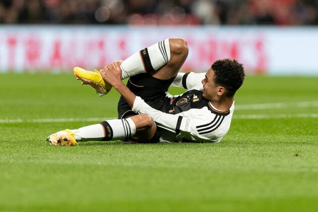 Mandatory Credit: Photo by Juan Gasparini JMP Shutterstock (13421987bs) Jamal Musiala of Germany looks injured after being fouled by Harry Maguire of England in the penalty area England v Germany, UK - 26 Sep 2022 Editorial use only England v Germany, UK - 26 Sep 2022 Editorial use only  Copyright: xJuanxGasparini JMP Shutterstockx 13421987bs
