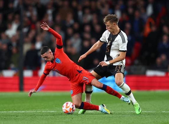 London, England, 26th September 2022. Nico Schlotterbeck of Germany tackles Phil Foden of England during the UEFA Nations League match at Wembley Stadium, London. Picture credit should read: David Klein Sportimage EDITORIAL USE ONLY. No use with unauthorised audio, video, data, fixture lists, club league logos or live services. Online in-match use limited to 120 images, no video emulation. No use in betting, games or single club league player publications. SPI-1909-0090