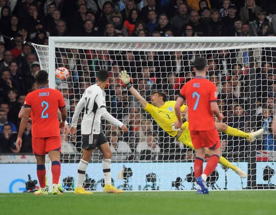 Football - 2023 UEFA Nations League - Group C - Round Six - England vs Germany - Wembley Stadium - Monday 26th September 2022 Kai Havertz of Germany curls a shot past goalkeeper Nick Pope of England for goal no 2 