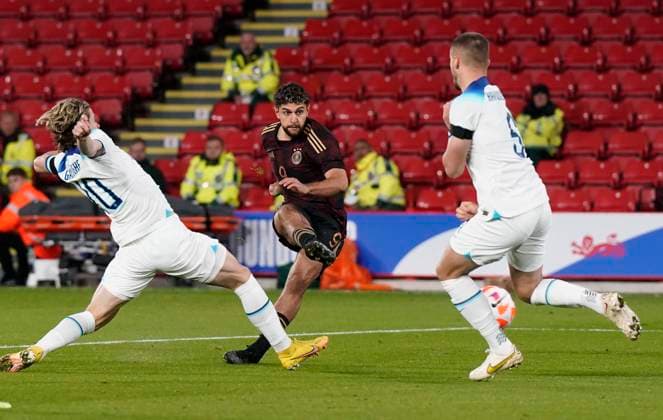 Sheffield, England, 27th September 2022. Reda Khadra of Germany takes a shot on goal during the International Friendly, Länderspiel, Nationalmannschaft match at Bramall Lane, Sheffield. Picture credit should read: Andrew Yates Sportimage EDITORIAL USE ONLY. No use with unauthorised audio, video, data, fixture lists, club league logos or live services. Online in-match use limited to 120 images, no video emulation. No use in betting, games or single club league player publications. SPI-1910-0022