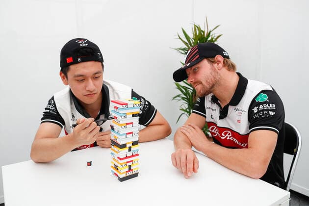 ZHOU Guanyu (chi), Alfa Romeo F1 Team ORLEN C42, BOTTAS Valtteri (fin), Alfa Romeo F1 Team ORLEN C42, portrait playing Sushi Jenga game during the Formula 1 Honda Japanese Grand Prix 2022, 18th round of the 2022 FIA Formula One World Championship, WM, Weltmeisterschaft from October 7 to 9, 2022 on the Suzuka International Racing Course, in Suzuka, Mie Prefecture, Japan - F1 - JAPANESE GRAND PRIX 2022 DPPI Panoramic 00122041__V2_5329
