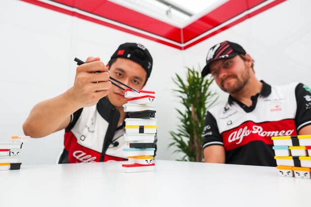 ZHOU Guanyu (chi), Alfa Romeo F1 Team ORLEN C42, BOTTAS Valtteri (fin), Alfa Romeo F1 Team ORLEN C42, portrait playing Sushi Jenga game during the Formula 1 Honda Japanese Grand Prix 2022, 18th round of the 2022 FIA Formula One World Championship, WM, Weltmeisterschaft from October 7 to 9, 2022 on the Suzuka International Racing Course, in Suzuka, Mie Prefecture, Japan - F1 - JAPANESE GRAND PRIX 2022 DPPI Panoramic 00122041_AV6_7057